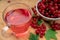 Drink of red currant in a glass Cup