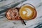 Drink scene of Hot Latt Coffee in yellow Cup on Brown wood Table at Coffee Cafe in Danang Vietnam