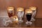 Drink, set of five gold rimmed glass goblets; photo on wooden background