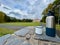 Drink tea on a hike against the background of the castle Duchcov, hands holding a thermos with a mug