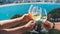 Drink three glasses white wine in friends hands outdoor seascape holidays, romantic couple toast with alcohol, happy people cheer