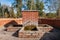 Drinking fountain faucet made of red bricks with fresh cold water running out from the ground of the earth