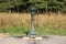 Drinking fountain placed in a natural park reservation garden
