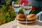 Drinking of French brut champagne sparkling wine with sweet apple Beignet, club party in yacht harbour of Port Grimaud near Saint-