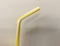 Drinking straw yellow tube isolated on white background