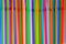 Drinking straws. Abstract background with many multi colored plastic tubules for juice or cocktail, single-use disposable. Top