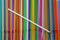 Drinking straws. Abstract background with many multi colored plastic tubules for juice or cocktail, single-use disposable. Top