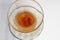 Drinking turkish tea in glass cup on white background.