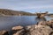 Drinking water dam in Frauenau in Bavarian Forest with outlet overflow in summer with little water filled to dry season, Germany