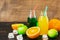Drinks orange juice on tarragon in bottles with fresh fruit.