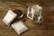 Drip coffee bags, beans and glass cup on wooden  table