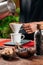 Drip Coffee Making. Barista Pouring Boiling Water From Kettle in Manual Drip Coffee Pot