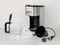 Drip-type coffee maker comprises: coffee machine, glass jug, basket mesh filter, removable filter holder and measuring spoon.