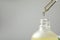 Dripping hydrophilic oil into bottle on grey background, closeup. Space for text