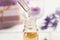 Dripping lavender essential oil into bottle