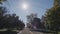 Drive along a typical street of an American town on a clear autumn day. Rear window view