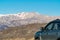 Drive a car to the snowy mountain peaks