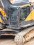 Driver cabin and continuous tracks on a heavy excavator digger machine.