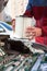 Driver hands inserting air cartridge inside airbox of car engine, close up view