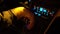 Driver man controls auto and hold hand on gear shifter or gear knob gear stick at night shadows road lights. Close up of