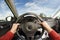 Driver\'s hands on steering wheel