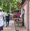 Driver sleeping on his bicycle rickshaw in New Delhi, India