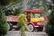 Driver sleeps in an old Asian truck made of wood