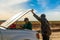 Driver and Tourists fix broken car during 4x4 Jeep Tour on Bolivian Altiplano, Bolivia