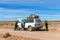 Driver and Tourists fix broken car during 4x4 Jeep Tour on Bolivian Altiplano, Bolivia