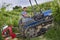 Driver on the tracked tractor works among the rows of vineyards in the Langhe and Roero hills in Piedmont the sky is cloudy and