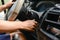 Driver turning on ingition on dashboard of a car