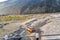 Driver washes his bus in a mountain river