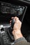 Drivers hand holds gear lever