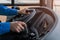 The drivers hands on the steering wheel of public transport. Trolleybus or bus driving. Background, toned