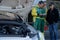 Drivers look at the times sheet during uphill race of Chamrousse