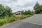 Driveway leading up to large luxury home on an overcast day real estate photo