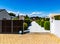 Driveway with white pebbles and rounded evergreen hedge Wanaka Otago New Zealand.