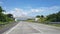 Driving along the highway road or toll road infrastructure with blue sky and white cloud