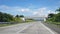 Driving along the highway road or toll road infrastructure with blue sky and white cloud