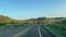 Driving through the badlands hills and mountains in Theodore Roosevelt National Park in North Dakota