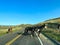 Driving through the badlands hills and mountains with Wild Horses standing in the road in Theodore Roosevelt National Park in