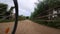 Driving a bicycle on a sandy path countryside front wheel point of view