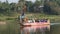 Driving boat with pilgrims on the Tungabhadra river.