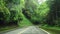 Driving Car along Beautiful Empty Road with Lush Green Foliage in Taiwan. Perspective View from Cabin