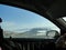 Driving a car around polish Tatra mountains - passanger driver interior perspective - side windows, driver hand and mountains view