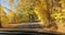 Driving a car through autumn landscaper