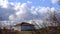 Driving of a car in Bulgarian way with huge clouds.