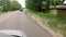 Driving a car on a country road. POV, point of view front, day.