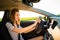 Driving a car at night - pretty, young woman driving her modern car