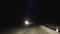 Driving car at night road in winter, snow, slippery blizzard weather mountains forest